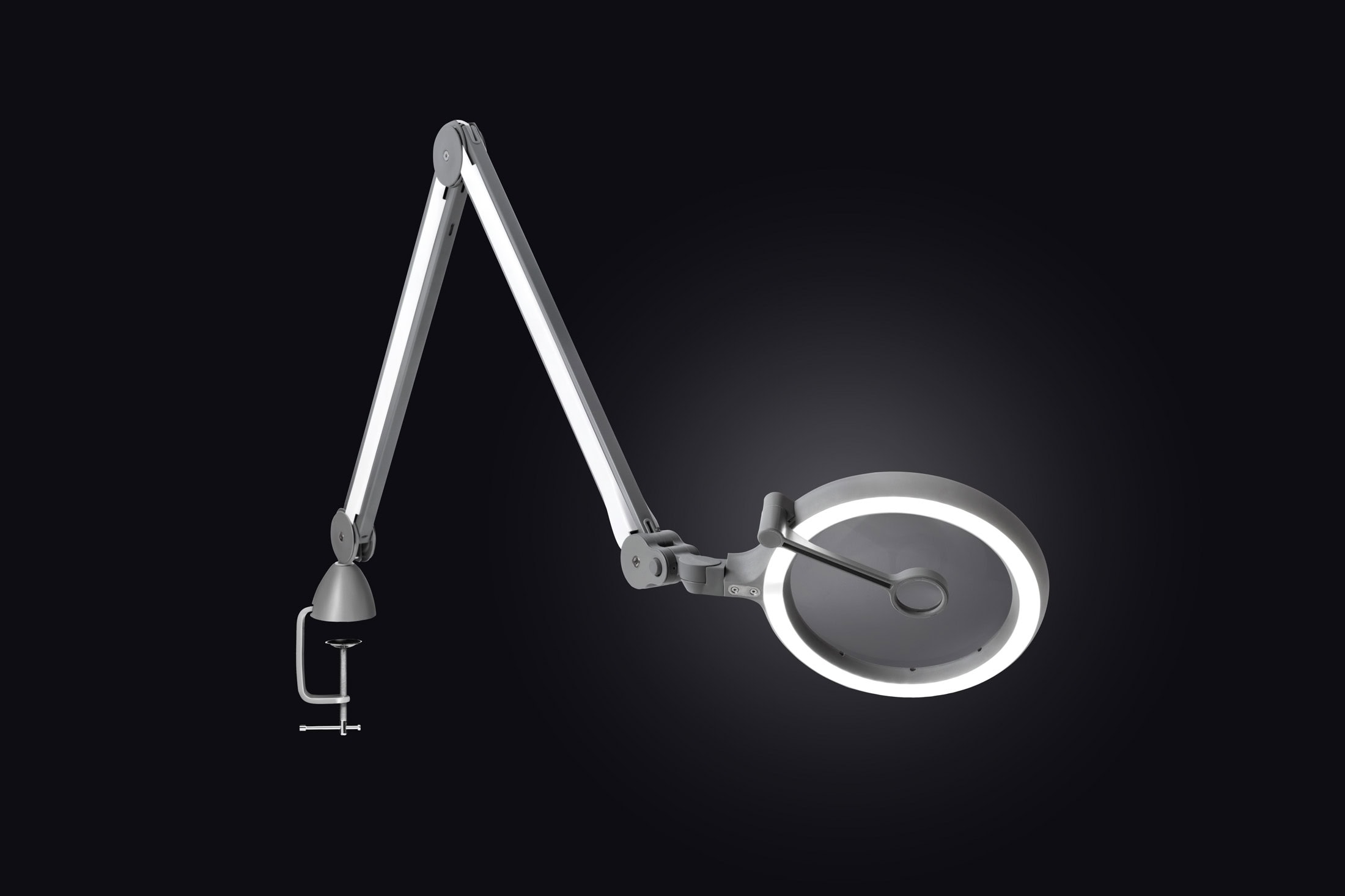 Vista completa de la lámpara con lupa LED Daylight iQ Magnifier con brazo articulado.